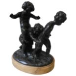 A LATE 19TH CENTURY BRONZE SCULPTURE ON AN OVAL MARBLE PLINTH, depicting three putti in a vineyard