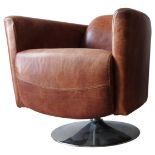 A CONTEMPORARY TAN LEATHER SWIVEL TUB CHAIR, stylish swept back shape, of superb faded worn