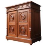 A RUSSIAN 19TH CENTURY LINEN CUPBOARD, two short frieze drawers above two doors with carved