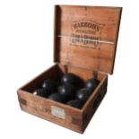 EIGHT VINTAGE HARRODS BOWLING WOODS, and two jacks, in a Harrod's stamped storage box