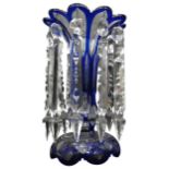 A BLUE OVERLAID GLASS LUSTRE, with crystal drops, 10.5 cm high