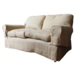 A GEORGE SMITH SCROLL ARM TWO SEAT SOFA, covered in a pale gold material, loose cushions, the legs