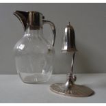 A MAPPIN & WEBB SILVER CANDLE SNUFFER AND WHITE METAL MOUNTED GLASS JUG