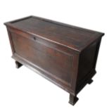 VERY RARE LATE ELIZABETHAN OAK CHEST WITH ITS ORIGINAL MOULDED FEET, although plain a rare early