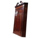 A LARGE GILT MAHOGANY HANGING CORNER CABINET, with swan neck pediments over an inlaid frieze cross-