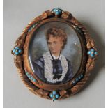 A LATE VICTORIAN PORTRAIT BROOCH, mounted in an ornate oval pinchbeck brooch, inset with turquoise