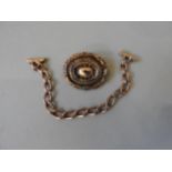 A PIECE OF GOLD CURB CHAIN AND VICTORIAN LOCKET Possibly a safety chain. Weight 10gms. Length