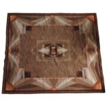 A VINTAGE ART DECO CARPET, machine woven, central geometric motif with sunburst pattern border,