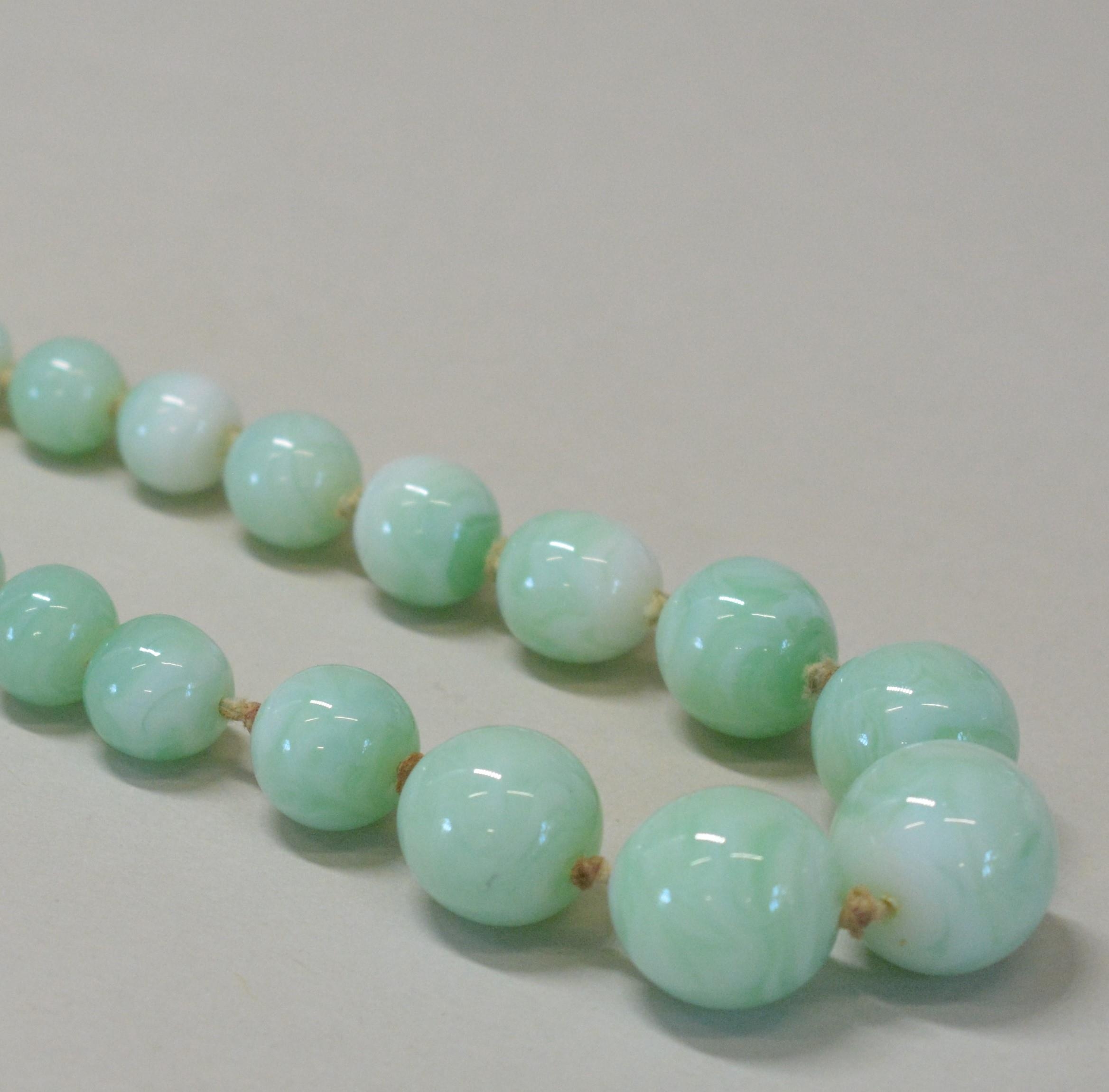 A GLASS IMITATION JADE BEAD NECKLACE Graduating green glass beads with silver bolt fastening. Weight - Image 2 of 2