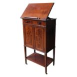 A 19TH CENTURY MAHOGANY INLAID MUSIC CABINET, with frieze drawer, adjustable tilting top, the