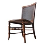 A VICTORIAN MAHOGANY NURSING CHAIR WITH WICKER PANELS, with turned legs and stretcher