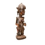 A BAULE MATERNITY FIGURE the female figure with stylised hair, added colour highlights and a