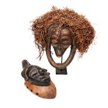 A USED CONGOLESE CHOKWE MASK WITH RAFIA HAIR and a small mask with coloured finish, possibly chokwe.