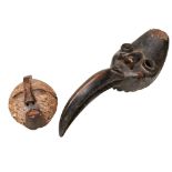 A USED DAN BIRD MASK with long curved beak, and a small Songye Kifwebe mask. 50 cms max