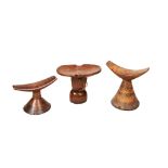 AN ETHIOPIAN CARVED WOODEN HEADREST another similar and another Ethiopian headrest PROVENANCE: The