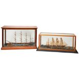 A HANDBUILT MODEL OF A FOUR MASTED SCHOONER on a naturalistic sea with two smaller vessels and