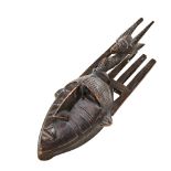 A BAMBARA MASK FROM MALI the comb-back with stylised antelope frontis. 20th century. 69 cms high.