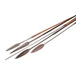 AN ASSEGAI with elongated forged iron petal shaped tip with wicker binding, two  others with shafts,