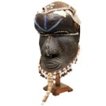 A KUBA HELMET MASK FROM THE DEMOCRATIC REPUBLIC OF CONGO with canvas, hide, bead and cowrei shell