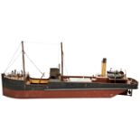 A TINPLATE ELECTRICALLY POWERED MODEL COASTAL FREIGHTER the stern with printed name ‘Digger