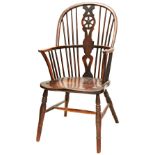 A 19TH CENTURY ELM-SEATED WHEEL BACK WINDSOR CHAIR of typical form. 95 cms high PROVENANCE: The
