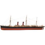 A MODEL OF A 19TH CENTURY PACKET STEAM SHIP with two funnels and detailed deck cabins displayed in a