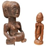 A VINTAGE SEATED LUBA FEMALE FIGURE WITH A BOWL a stylised Dogon figure and another figure. 28 cms