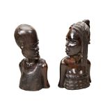 A PAIR OF AFRICAN CARVED IRONWOOD BUSTS OF A MAN AND WOMAN 20th century 31 cms max PROVENANCE: The