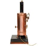 A FREE STANDING VERTICAL COPPER STEAM BOILER on a folded sheet metal base, with black lacquered