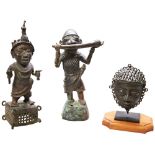 A NIGERIAN BENIN STYLE BRONZE FIGURE OF A HORN PLAYER another of a standing warrior and a small
