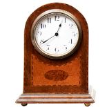 AN EDWARDIAN ARCHED TOP MAHOGANY MANTEL CLOCK with inlaid front panel. 21 cms PROVENANCE: The
