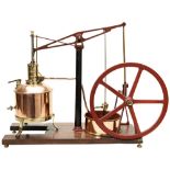 AN ENGINEERED MODEL OF A BEAM PUMPING ENGINE with copper and brass boiler and pumping pond mounted
