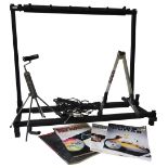 A FOLDING RACK STAND FOR FIVE GUITARS two single guitar stands, a desk top adjustable microphone