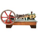A HEAVY ENGINEERED MODEL OF A HORIZONTAL STEAM ENGINE on a cast iron platform and wooden base,