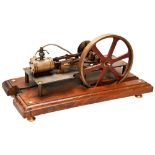 AN ENGINEERED MODEL OF A HORIZONTAL STEAM ENGINE with a sprocket drive wheel. 33 cms long max