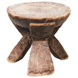A WEST AFRICAN WOODEN TRIPOD STOOL probably Hehe and two other tribal stools. 32 cms max PROVENANCE: