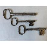 A 19TH CENTURY POLISHED STEEL KEY , with large bow, collared shaft and folding cylindrical bit,