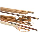 A LONG WOODEN TRANSIT CASE CONTAINING A SELECTION OF SPLIT CANE AND BAMBOO FISHING RODS, dating from