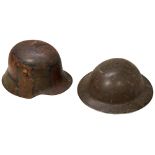 A GERMAN WORLD WAR I M16 STEEL HELMET with original Sz 62 camouflage paint and partial remains of