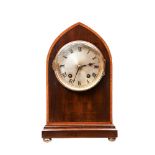 AN EDWARDIAN GEORGE III STYLE ARCHED TOP MAHOGANY MANTEL CLOCK with slivered dial. 27 cms high