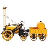 A HORNBY LIVE STEAM 3 1/2 INCH GAUGE STEPHENSON'S ROCKET AND TENDER and a box of track. Play worn.