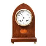 AN EDWARDIAN GEORGE III STYLE ARCHED TOP MAHOGANY MANTEL CLOCK with enamelled dial. 29 cms high