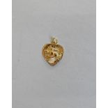 A CHINESE DECORATED HEART SHAPED GOLD FOB, 18ct gold (possibly 22ct gold), engine turned engraved