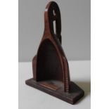 A CARVED TREEN SCULPTURE OF PACIFIC TRIBAL BOAT PROW, bearing a brass plaque inscribed 'Cook