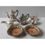 A SILVER PLATED COFFEE POT, PLATED TEAPOT ON STAND, THREE LARGE PLATED SAUCE BOATS AND A PAIR OF