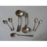 A PAIR OF GEORGIAN SILVER SAUCE LADLES , circa 1827, along with four bright cut silver teaspoons and