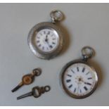 TWO CONTINENTAL LADIES SILVER FOB WATCHES, both in ornate engine turned cases, stamped with marks on