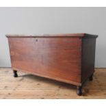 A MAHOGANY BLANKET BOX, of simplistic form, constructed from dovetailed panels, on four turned legs,