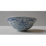 A CHINESE BLUE AND WHITE BOWL, decorated with scrolling flowering vines, with apocryphal mark,