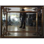 A LARGE 20TH CENTURY MIRROR, in an ornate gilt frame, rococo styled scroll shell decorated corners